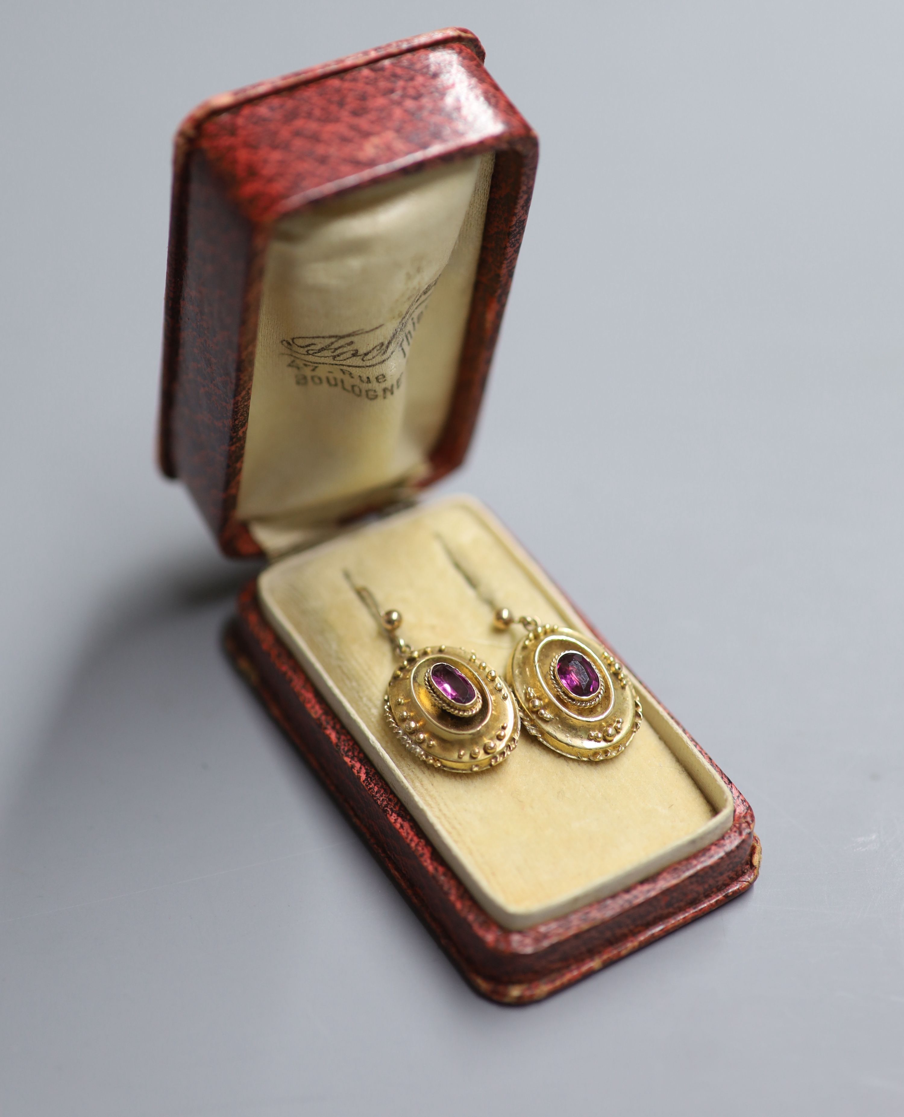 A pair of Victorian yellow metal and garnet set oval drop earrings, 18mm, gross 4 grams.